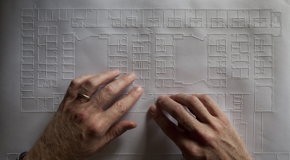 View of tactile floorplan being read by Architect Chris Downey (Credits: Fogg Studio, Chris Downey, The Atlantic Citylab)